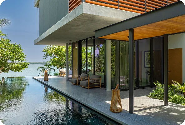 Infinity pool overlooking the bay at a modern waterfront home
